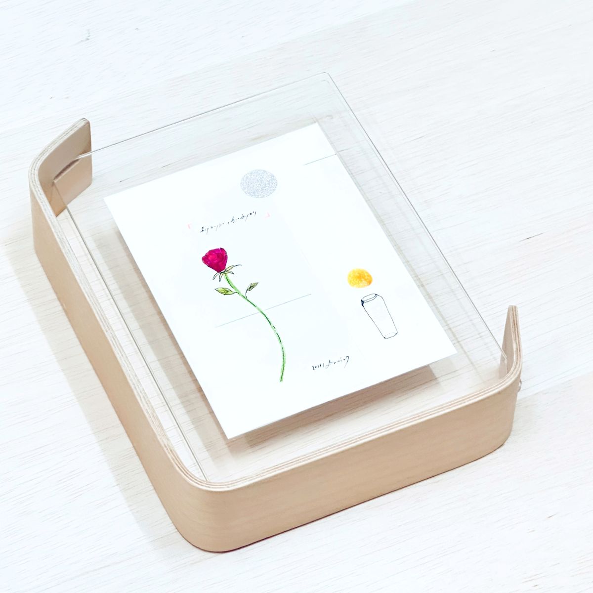 ツクルヒトタチ博 一輪の花、となりにはグラス。タニモト 大作